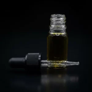 THC bottle on a black background.