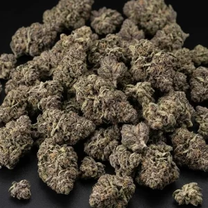 Blueberry Blue Dream cannabis flower on a black bg.