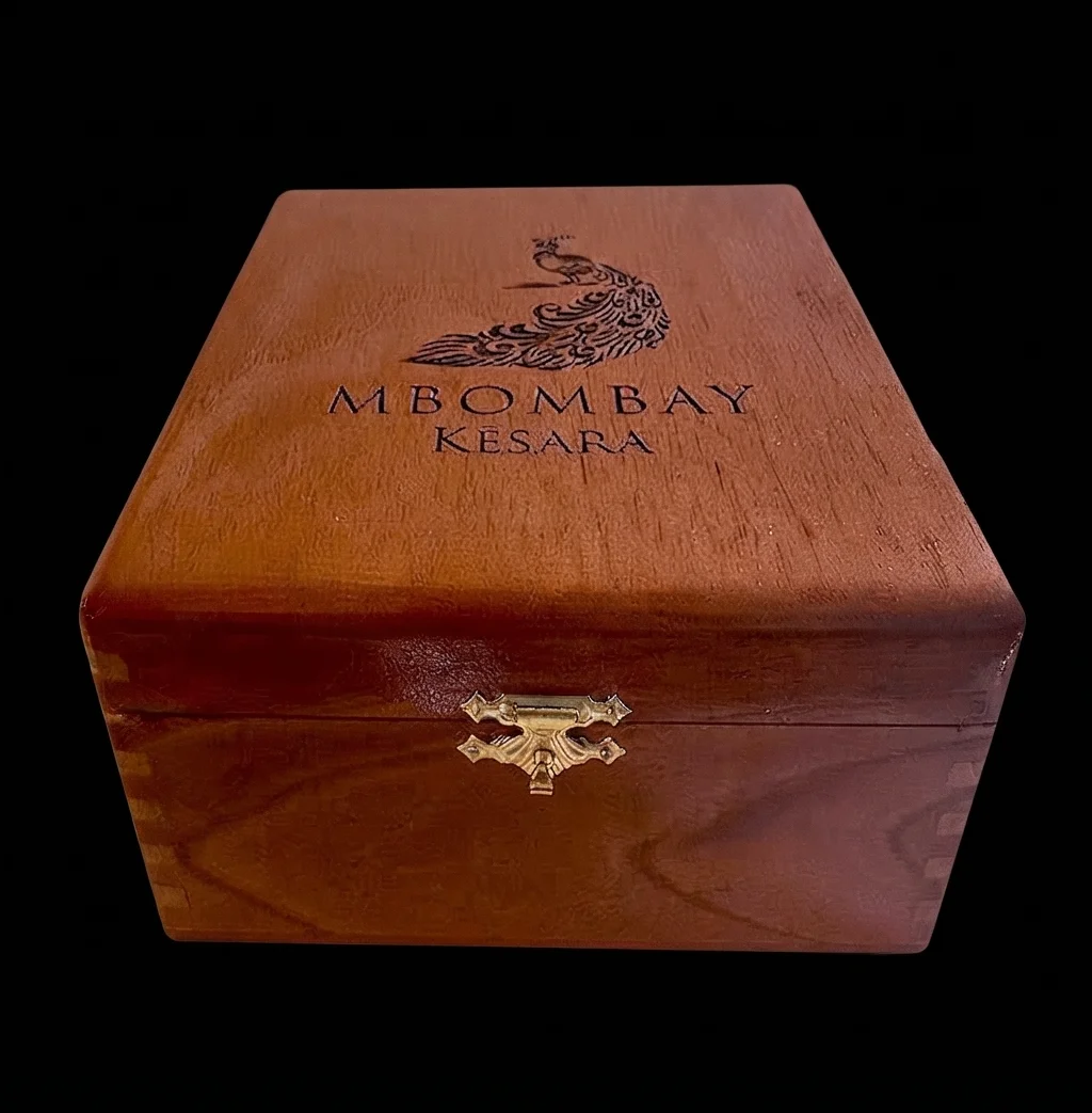 MBombay Kesara Wooden Stash Box on a black bg.